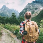 Hiker walking to mountains