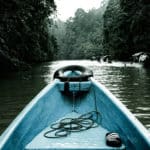 Blue and black kayak on lake