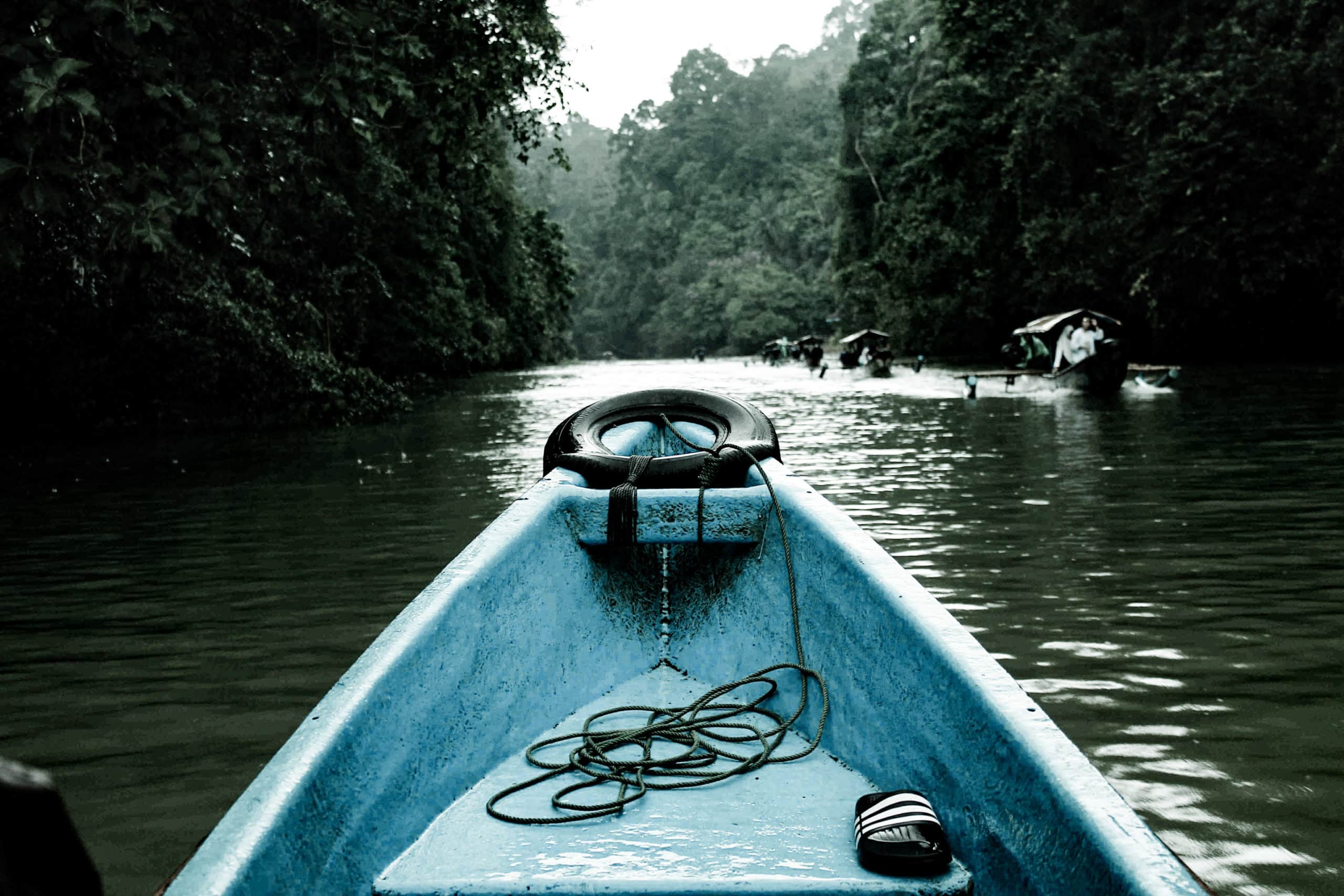 Blue and black kayak on lake