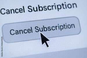 Termination concept with cursor clicking on cancel subscription button on digital screen representing end of service agreement