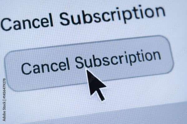 Termination concept with cursor clicking on cancel subscription button on digital screen representing end of service agreement
